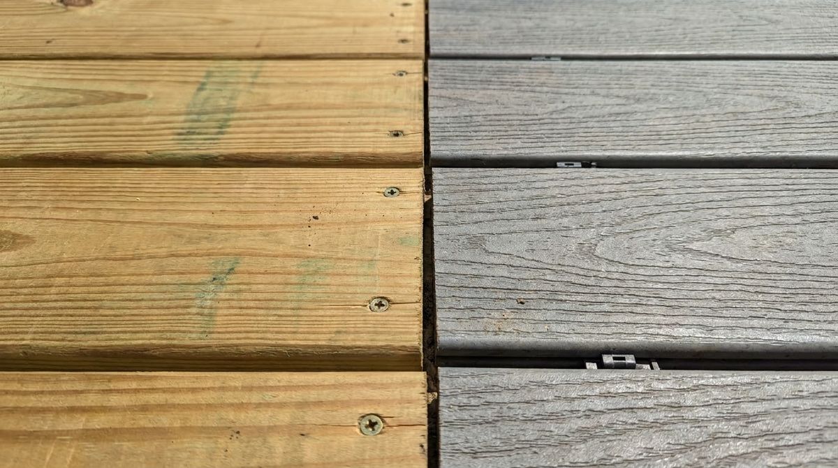 Pressure-treated pine deck boards next to gray composite deck boards on one deck frame