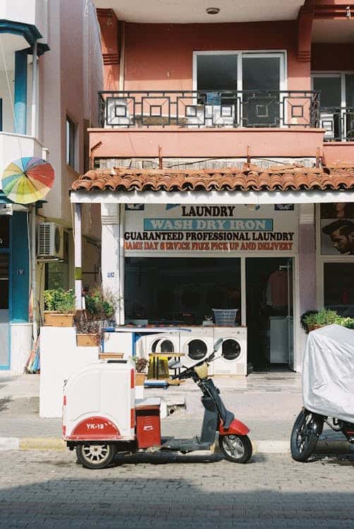 Laundry shop storefront on a Saigon street — what most tourists find when searching laundromat near me in Ho Chi Minh City