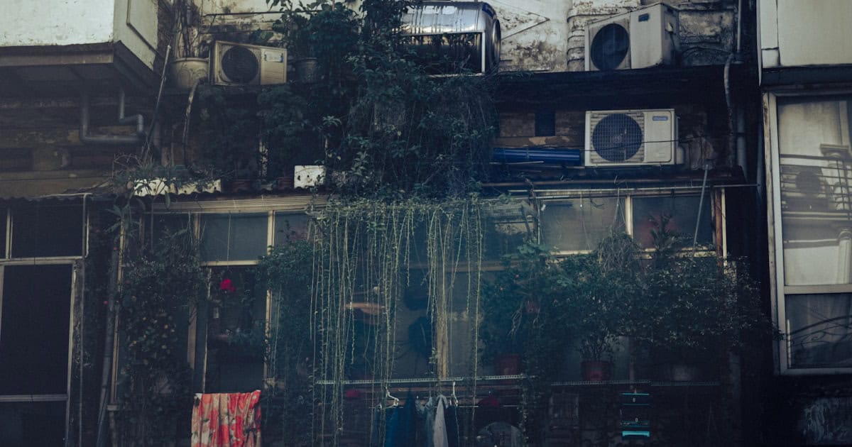 Hanoi apartment building exterior with laundry hanging from balconies — a common sight across Vietnam cities