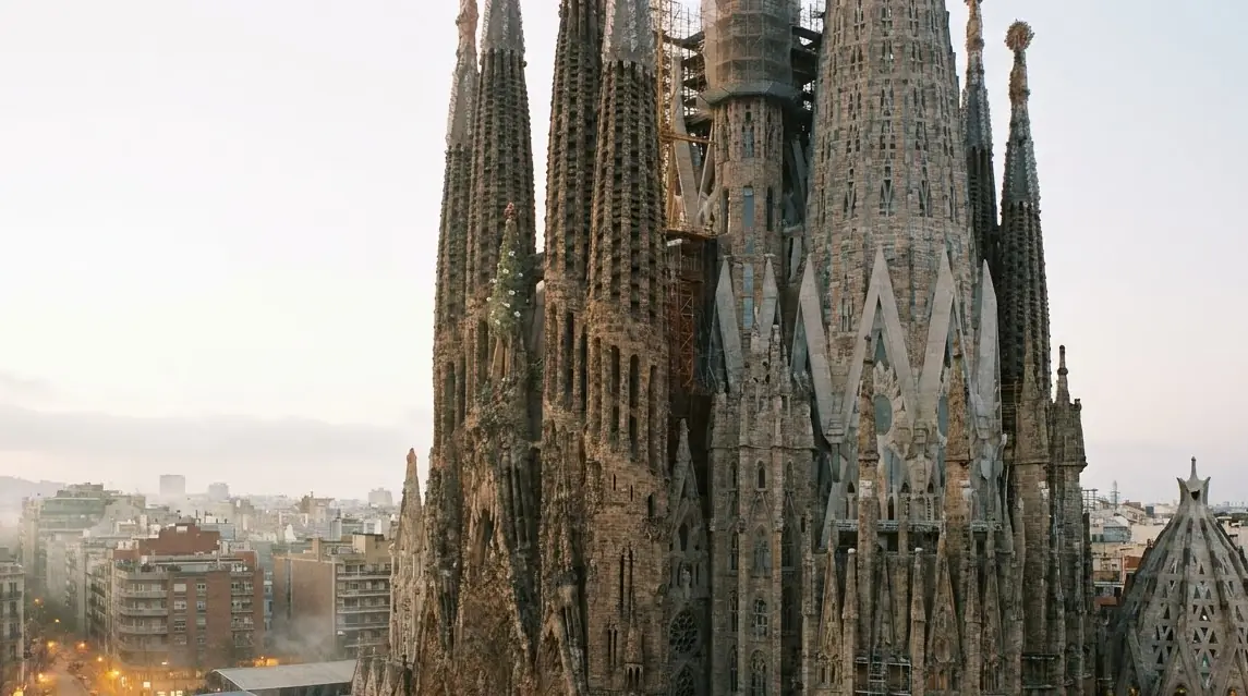Illustration of a basilica with tall stone spires in Barcelona in morning light