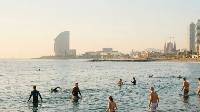 Illustration of a city beach in Barcelona with the skyline behind