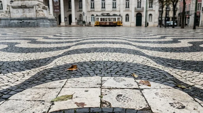 Illustration of patterned black and white stone paving in Lisbon