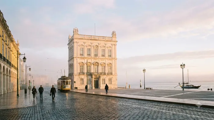 Illustration of a riverfront square in Lisbon in the early morning