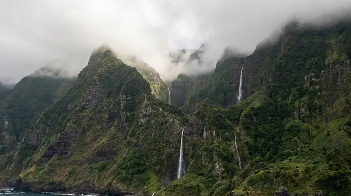 Illustration of green cliffs and waterfalls on Madeira's north coast