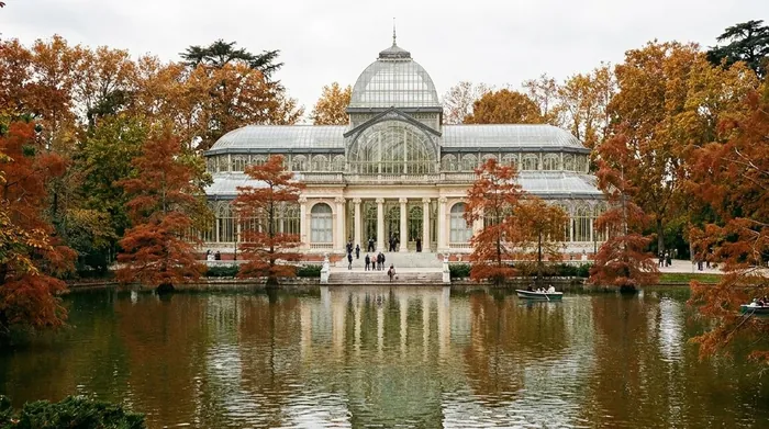 Illustration of a glass pavilion reflected in a pond in a Madrid park