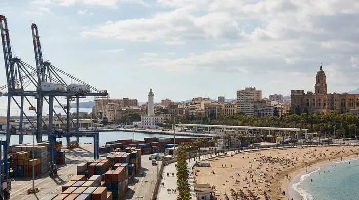Illustration of a port and cranes beside a city beach in Málaga