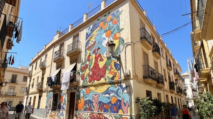 Illustration of a large street mural in a Málaga neighbourhood
