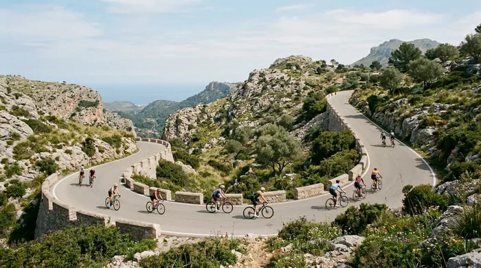 Illustration of cyclists on a winding mountain road on Mallorca