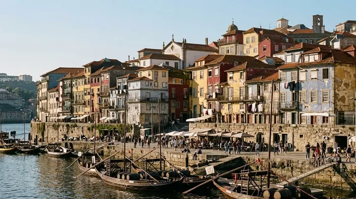 Illustration of narrow colourful houses on Porto's riverside quay