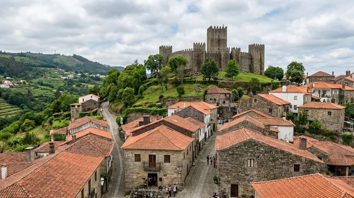 Illustration of a medieval castle above a small town in northern Portugal