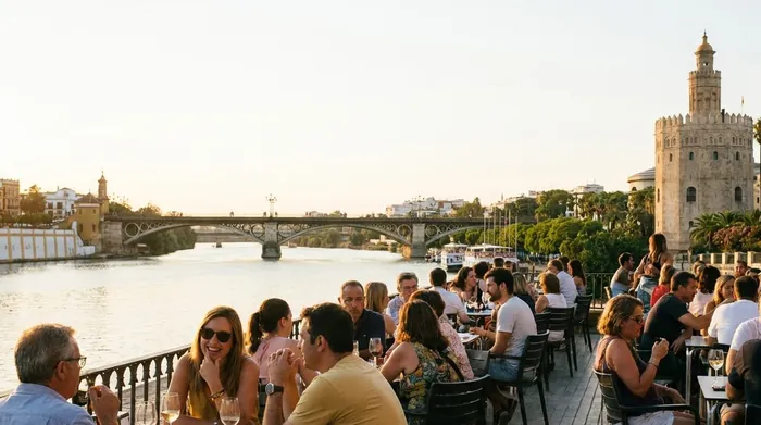 Illustration of people on a riverside terrace in Seville in the evening