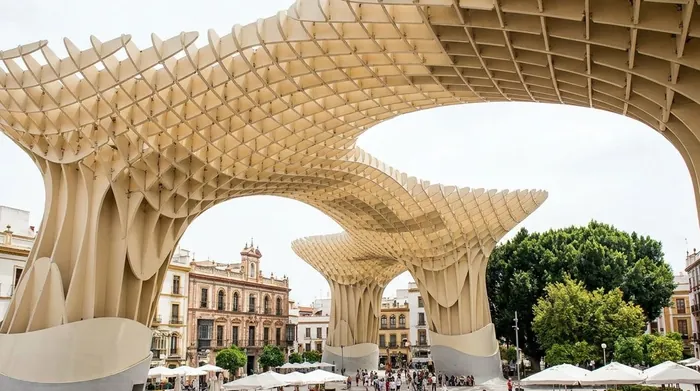 Illustration of a large wooden canopy structure over a square in Seville