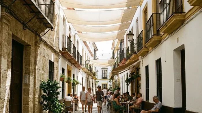 Illustration of canvas shades stretched over a narrow street in Seville