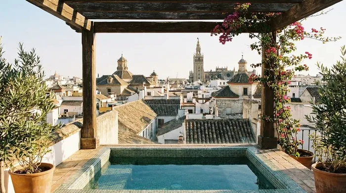 Illustration of a rooftop plunge pool above Seville