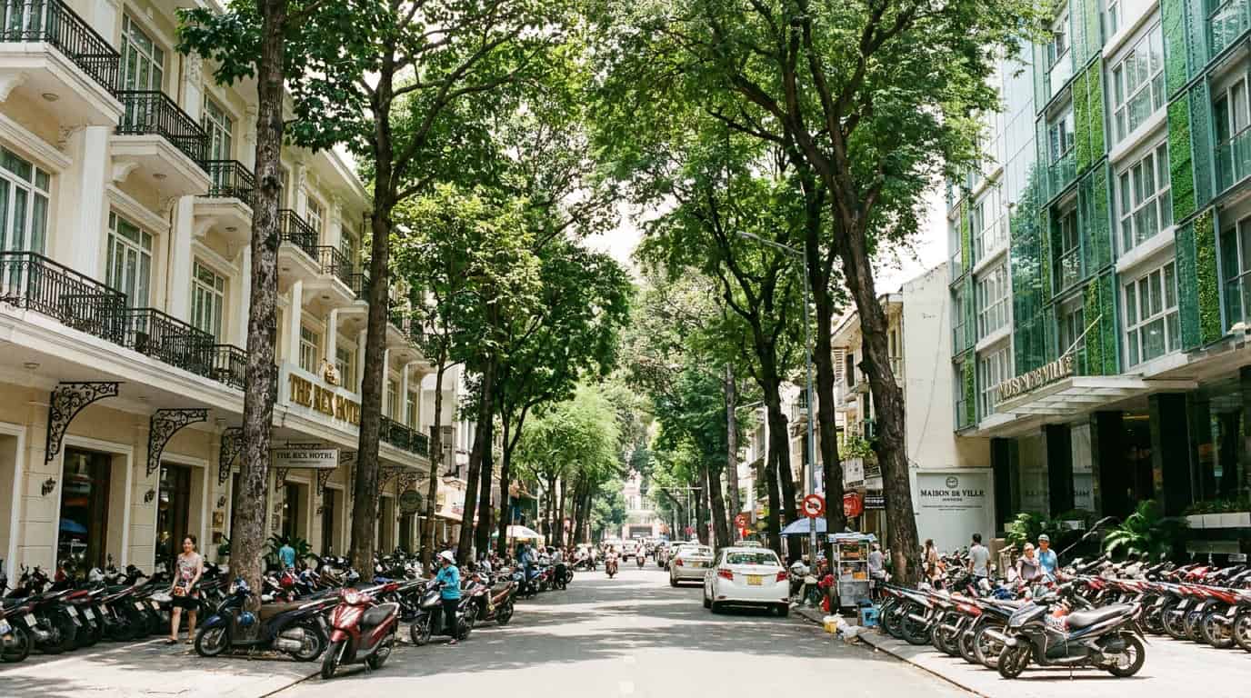 Hotel and serviced apartment buildings on a leafy street in District 1 Ho Chi Minh City