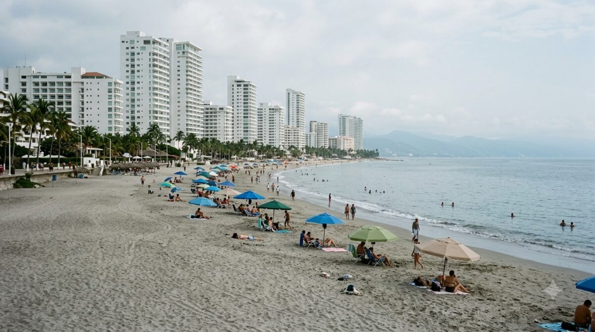 Grey-sand beach backed by modern high-rise hotel towers in Bocagrande, Cartagena