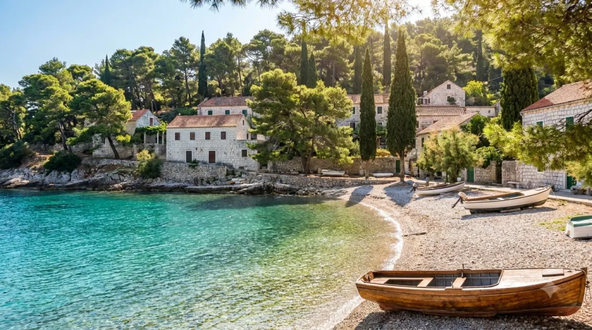 A sheltered bay with a pebble beach and pine trees on the Lapad peninsula