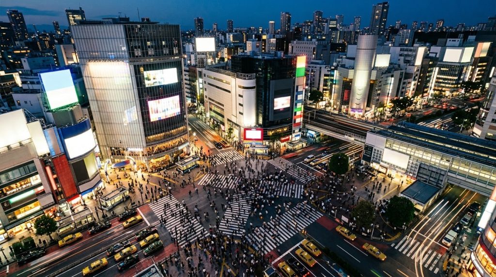 Shibuya scramble crossing in Tokyo seen from above at dusk