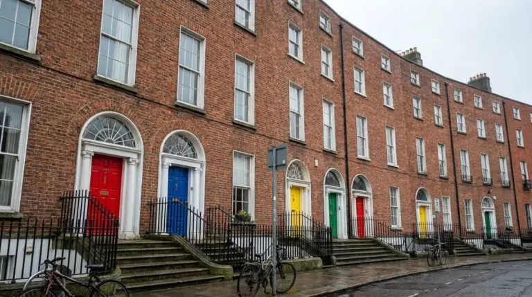 A terrace of Georgian brick houses with brightly painted front doors and fanlights, Dublin, Ireland