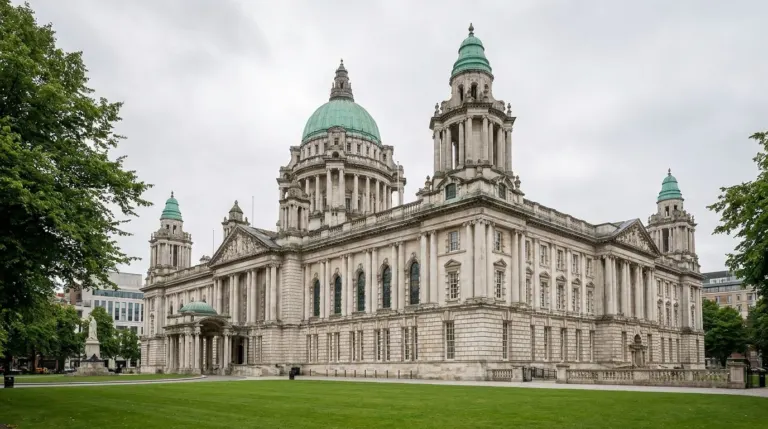 A large domed Edwardian city hall building behind green lawns, Donegall Square, Belfast, Northern Ireland