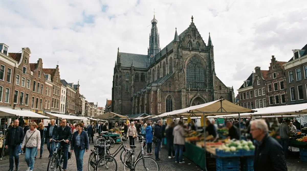 A market square with a vast gothic church and gabled houses around it, Haarlem, Netherlands