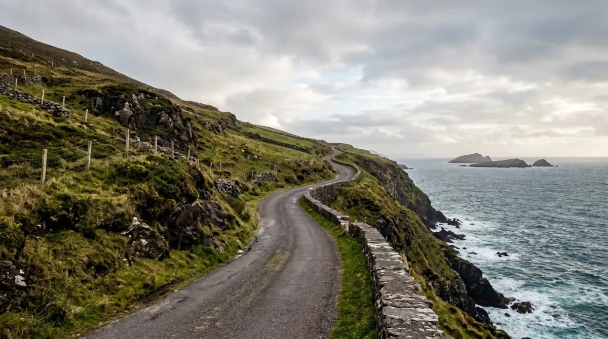 A road curving along a high cliff edge above the sea with small islands offshore, Dingle Peninsula, County Kerry, Ireland