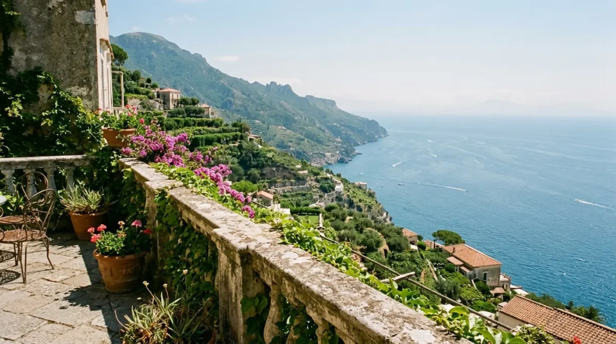 A garden villa terrace with a stone balustrade looking straight down the green coast to the sea, Ravello, Italy