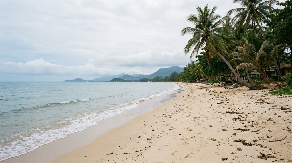 Quiet off-season stretch of Chaweng Beach in Koh Samui under soft light