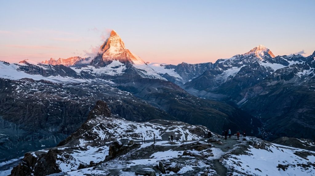 Matterhorn peak glowing at sunrise above Zermatt, Switzerland
