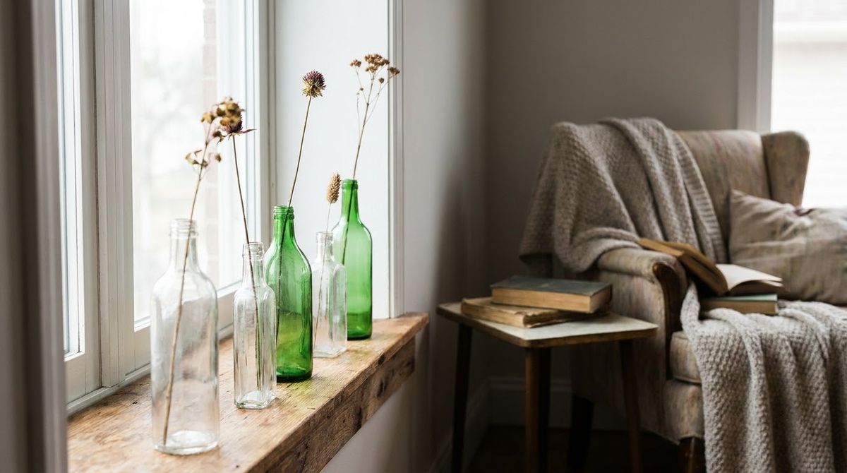 A Row of Thrifted Glass Bottles: cottagecore windowsills reading corners idea A Row of Thrifted Glass Bottles: cottagecore windowsills reading corners idea