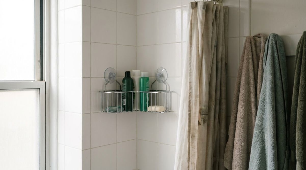 A Suction Corner Basket idea for small bathroom ideas with shower in a small rental